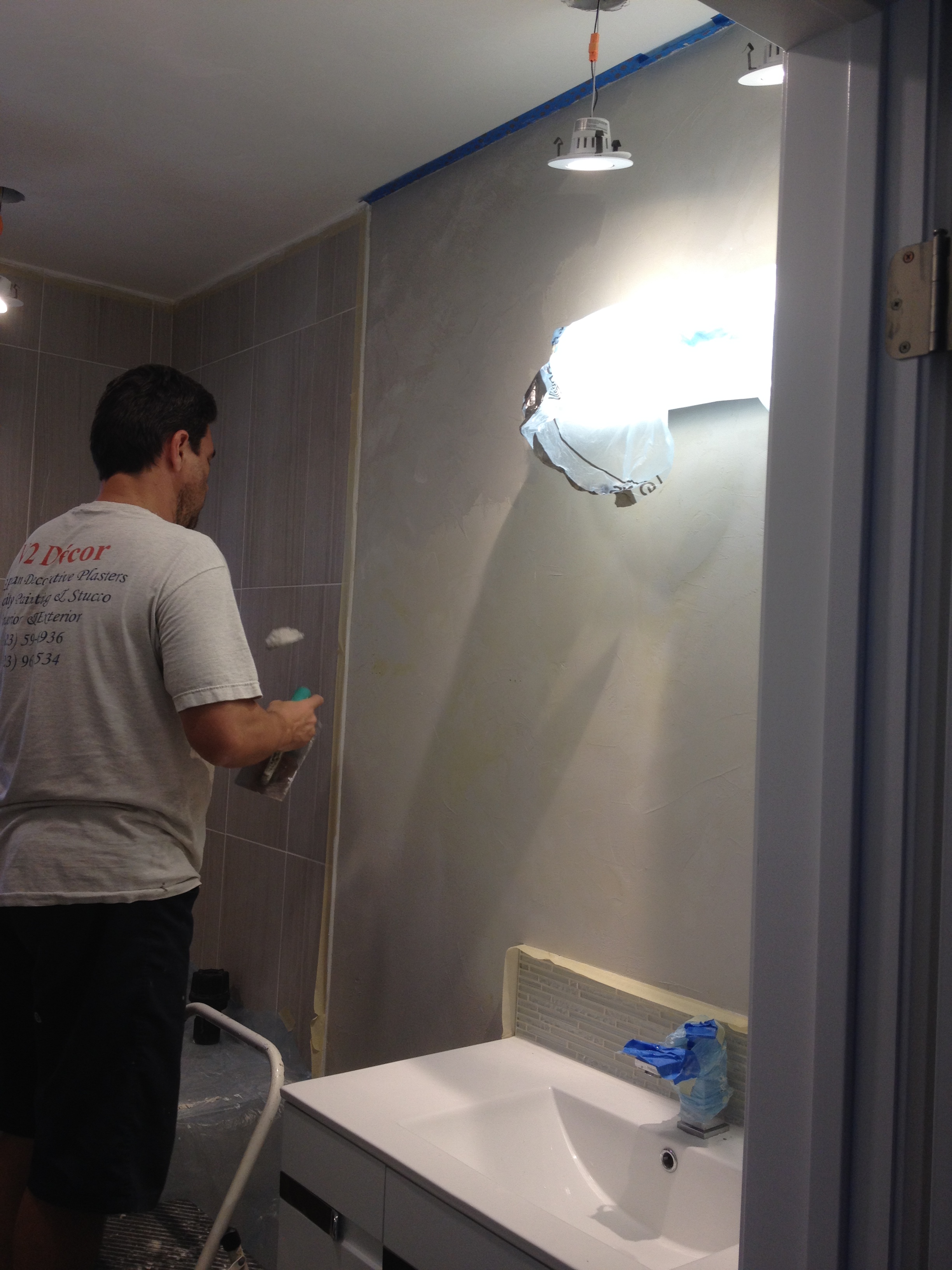 Victor Orel hand-applying a decorative plaster finish
